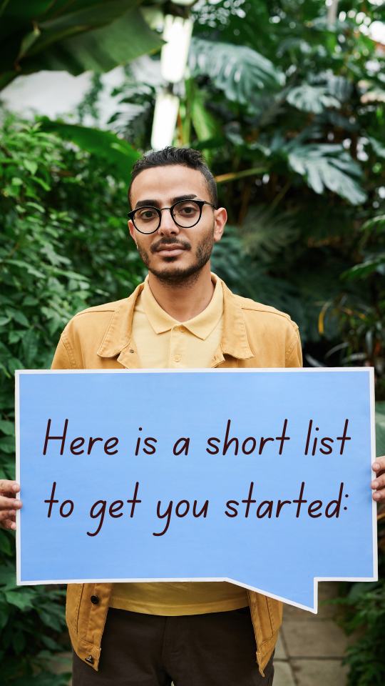 Man stands in front of lush plants holding a sign which reads: "Here is a short list to get you started:"
